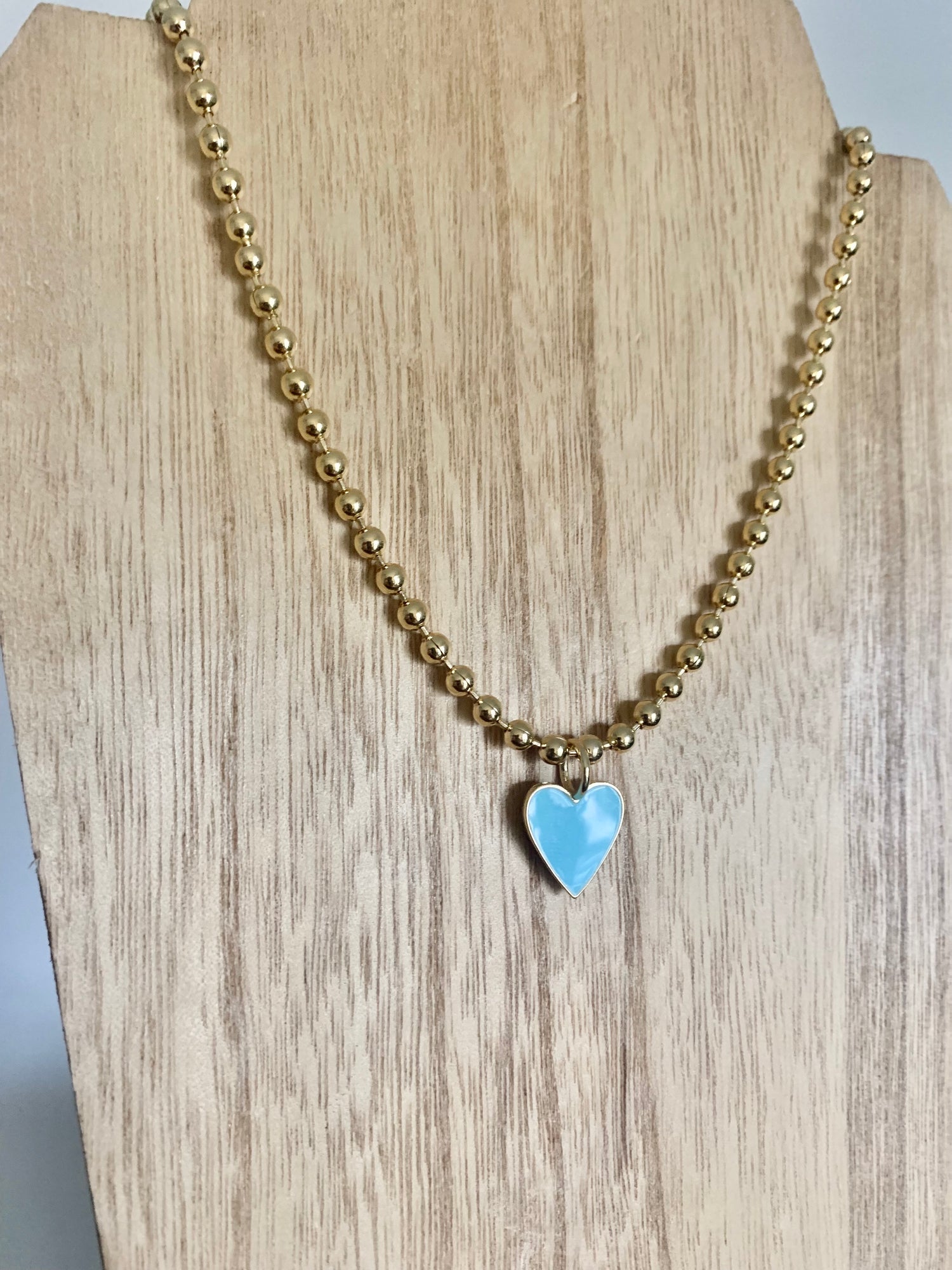 18 Karat Gold Plated Beaded Necklace with Enamel Heart Pendant on a 18 inch adjustable chain.