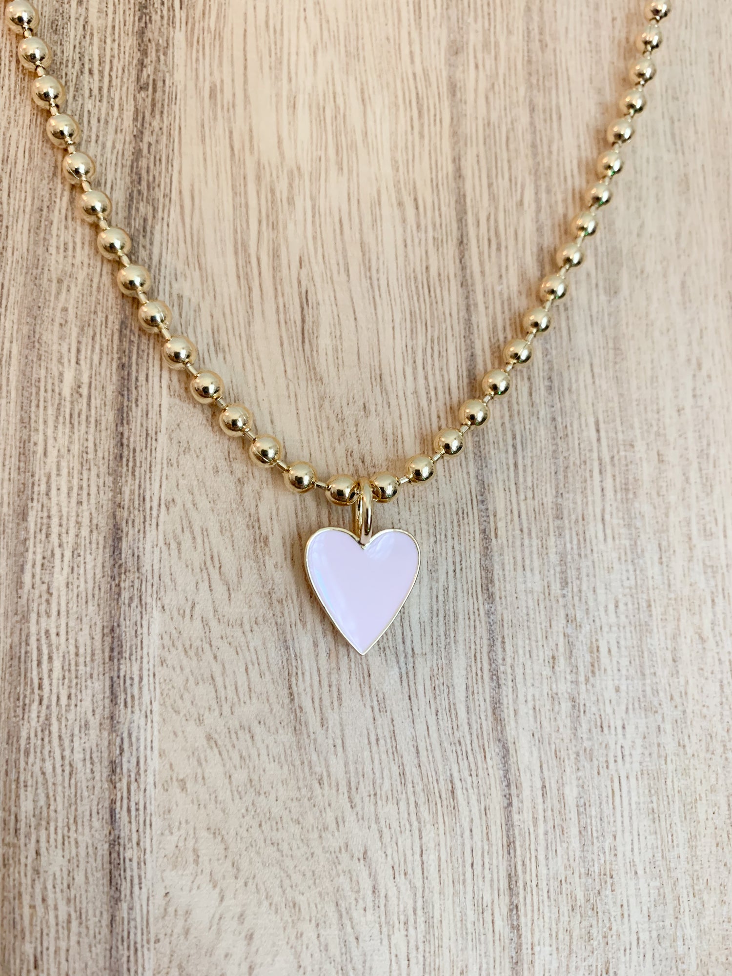 18 Karat Gold Plated Beaded Necklace with Enamel Heart Pendant on a 18 inch adjustable chain.
