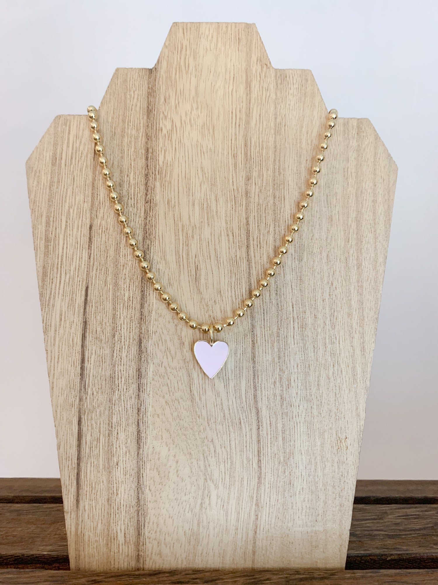 18 Karat Gold Plated Beaded Necklace with Enamel Heart Pendant on a 18 inch adjustable chain.