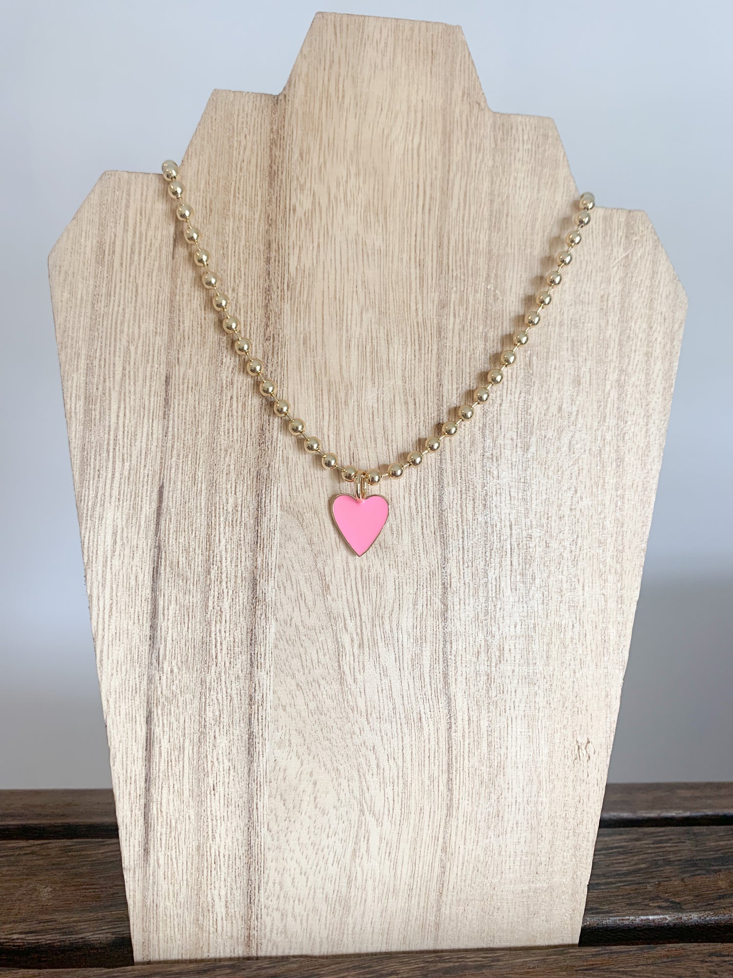 18 Karat Gold Plated Beaded Necklace with Enamel Heart Pendant on a 18 inch adjustable chain.