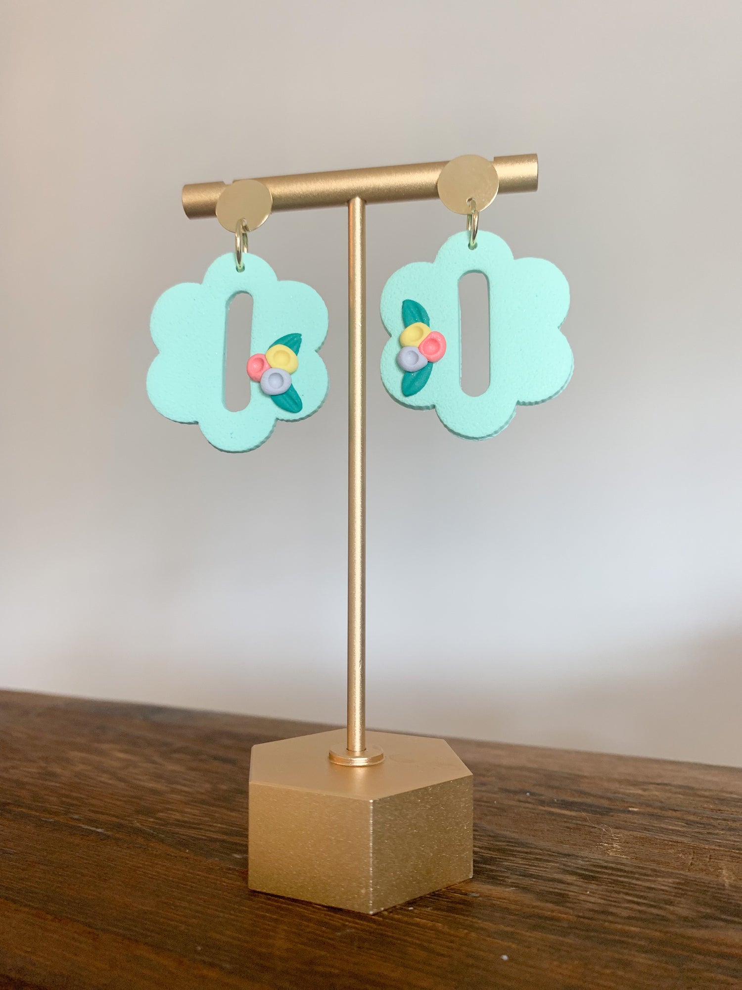 Handcrafted polymer clay earrings with intricate design and 18k gold plated earring posts