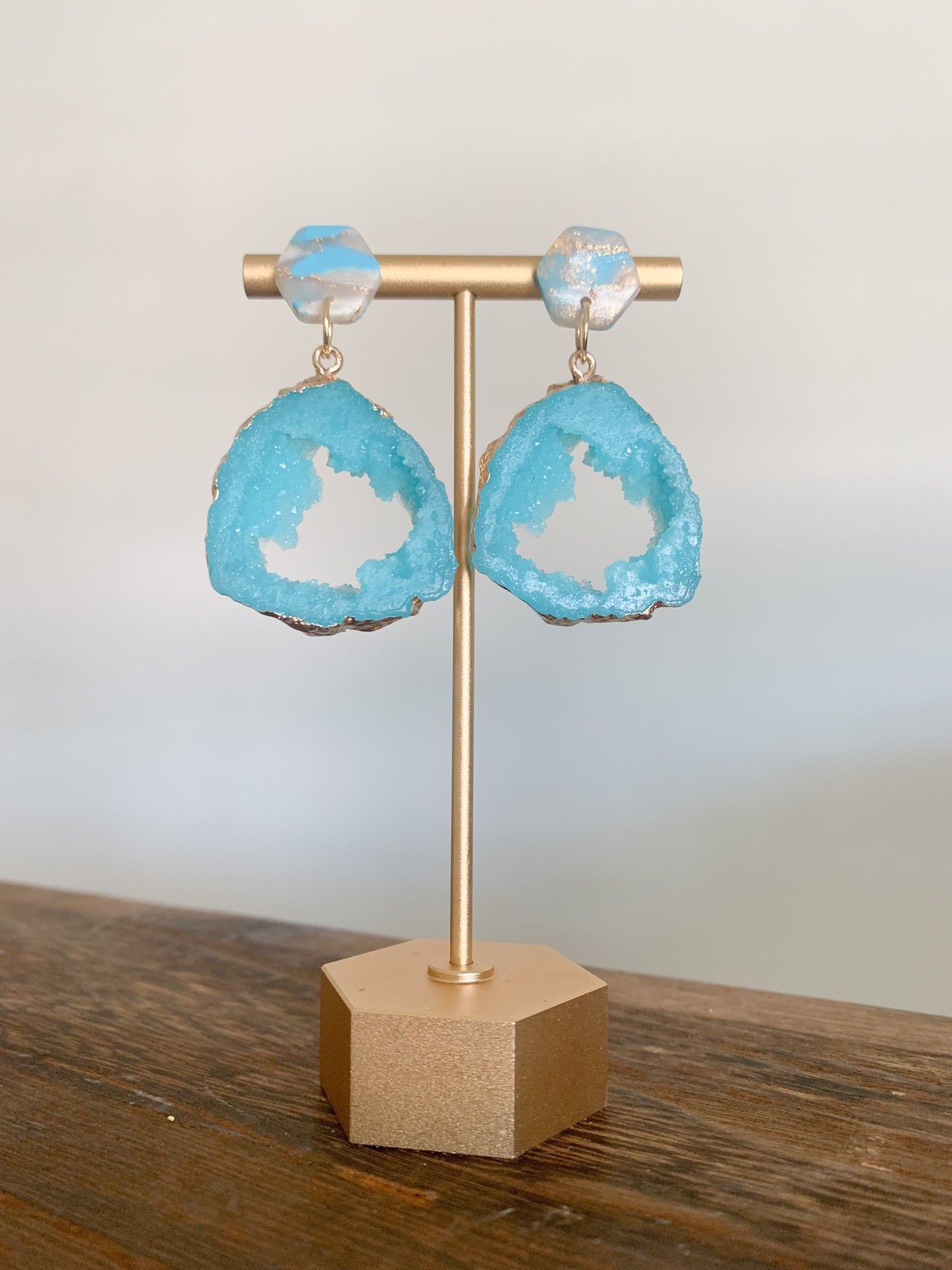 Handmade polymer clay earrings with a large druzy resin charm