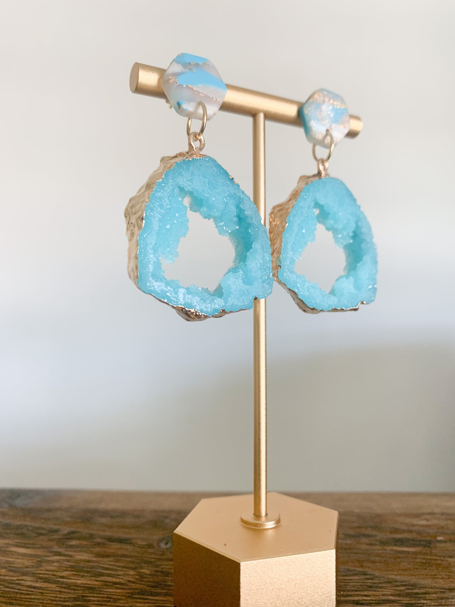 Handmade polymer clay earrings with a large druzy resin charm