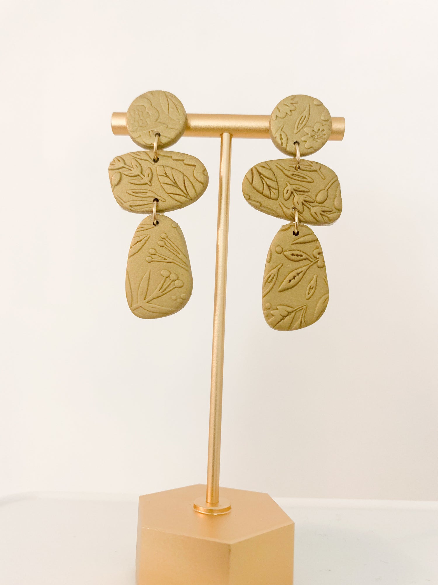 Handcrafted polymer clay earrings with intricate design and 18k gold plated earring posts