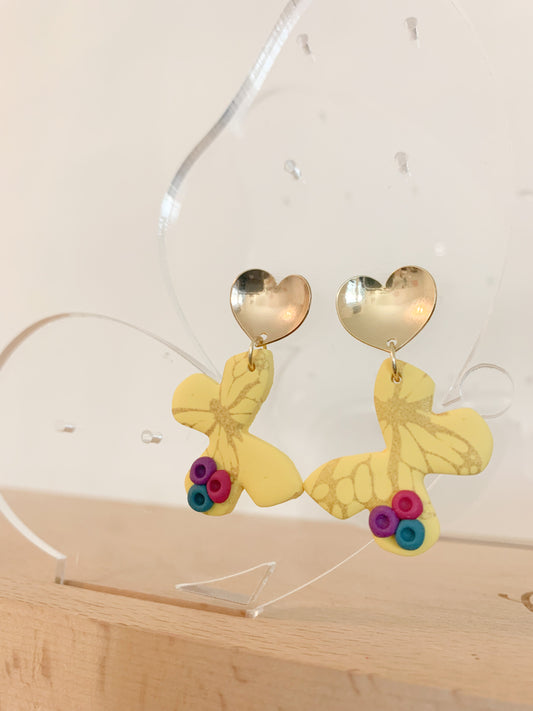 Handcrafted polymer clay earrings with intricate design and 18k gold plated earring posts