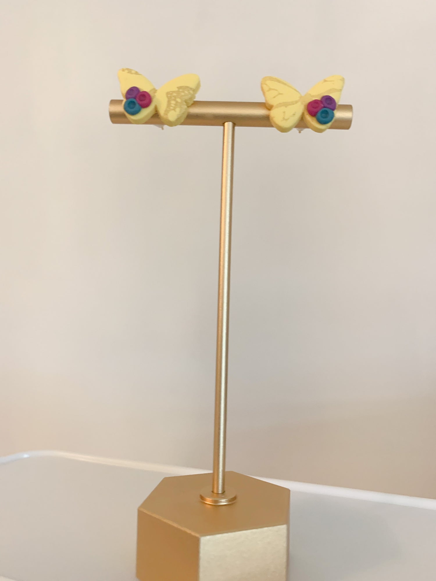 Handcrafted polymer clay earrings with intricate design and 18k gold plated earring posts