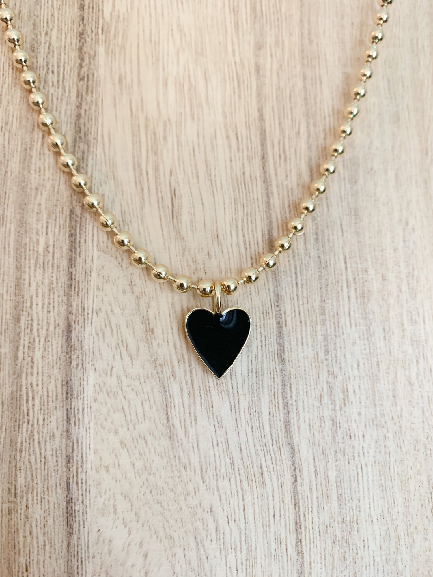 18 Karat Gold Plated Beaded Necklace with Enamel Heart Pendant on a 18 inch adjustable chain.