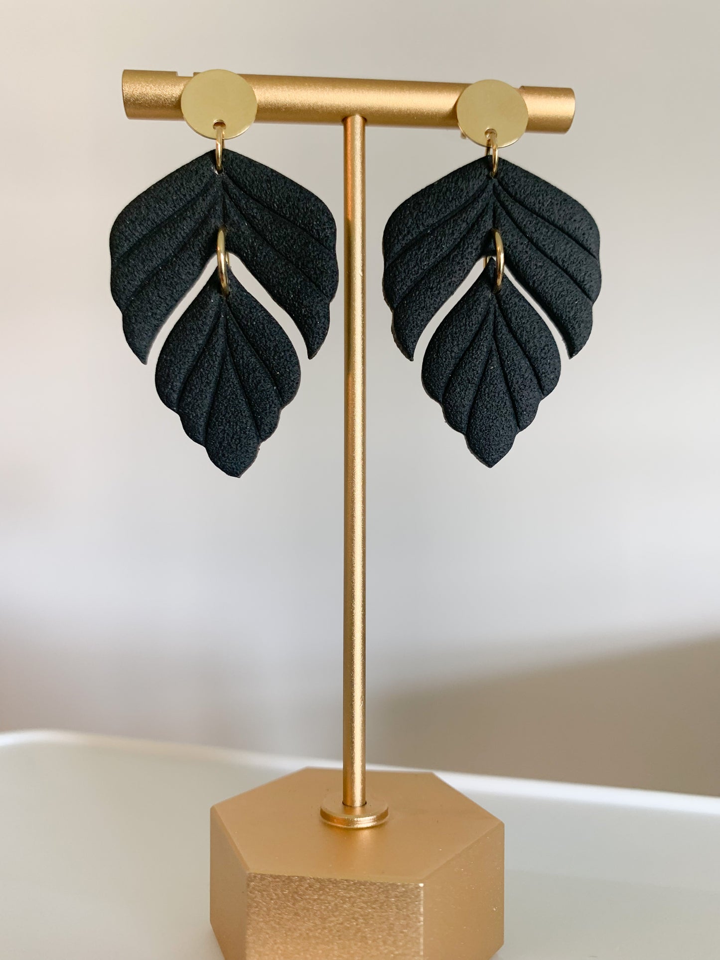 Handcrafted polymer clay earrings with intricate design and 18k gold plated earring posts