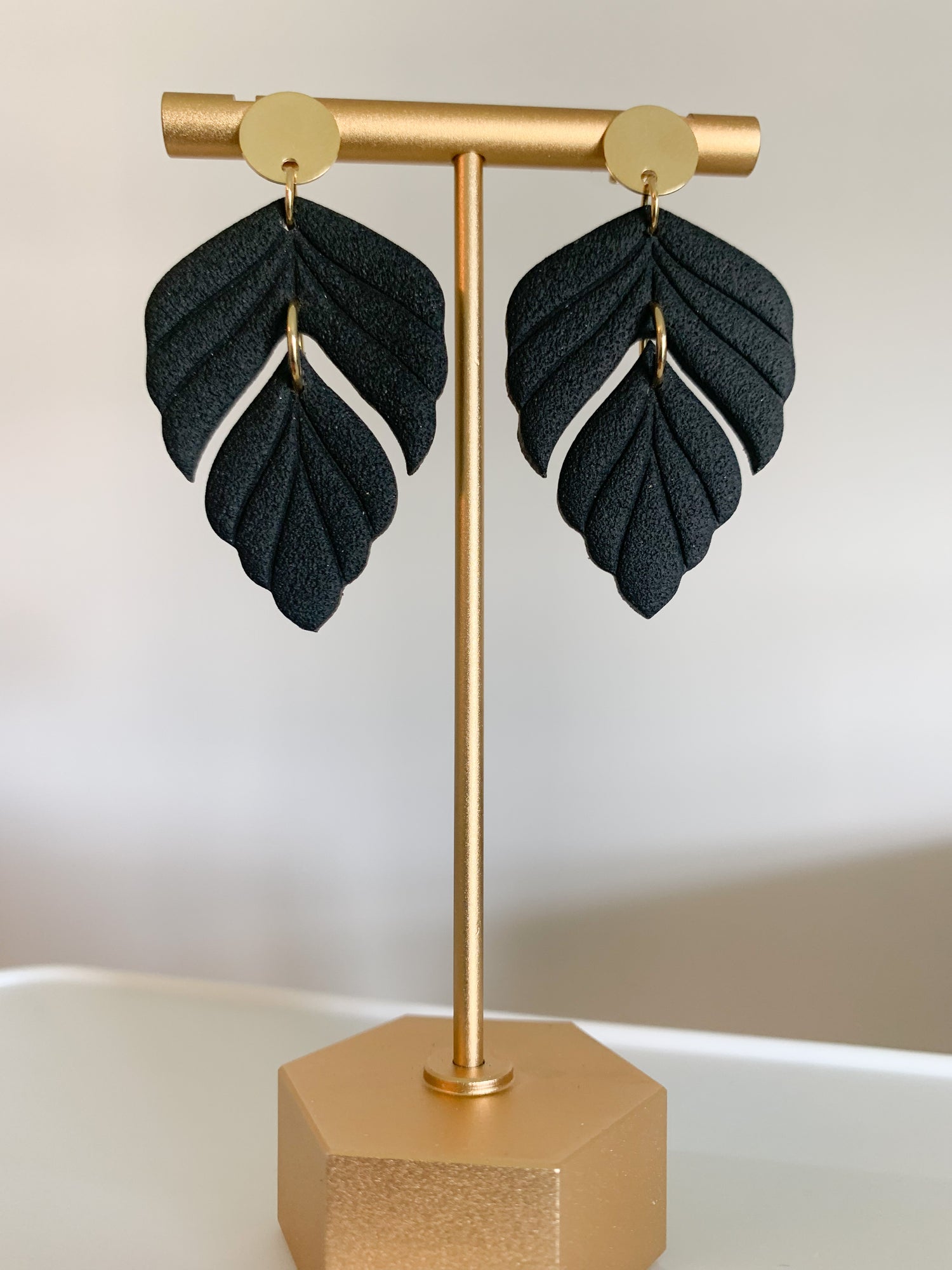 Handcrafted polymer clay earrings with intricate design and 18k gold plated earring posts