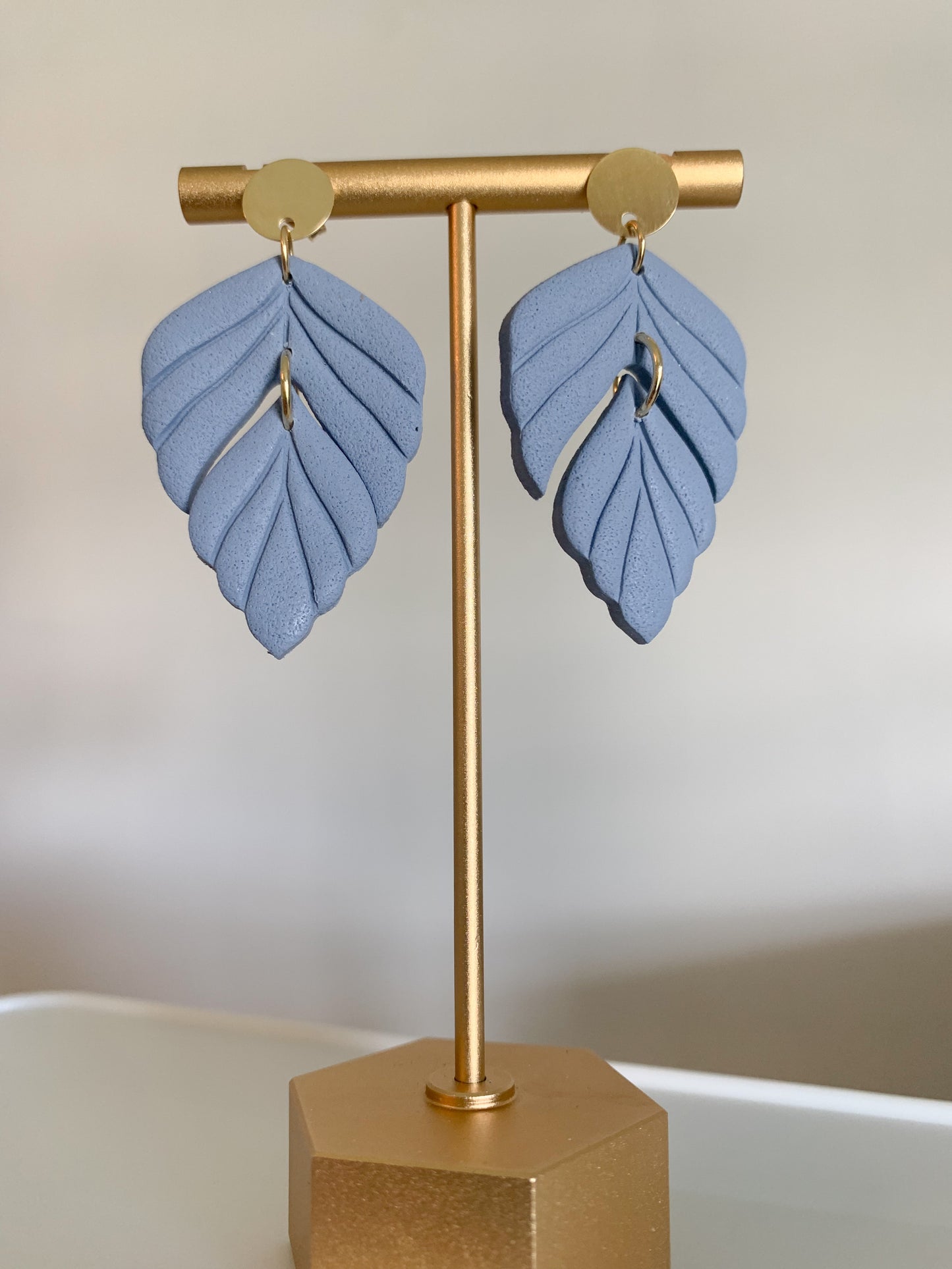 Handcrafted polymer clay earrings with intricate design and 18k gold plated earring posts
