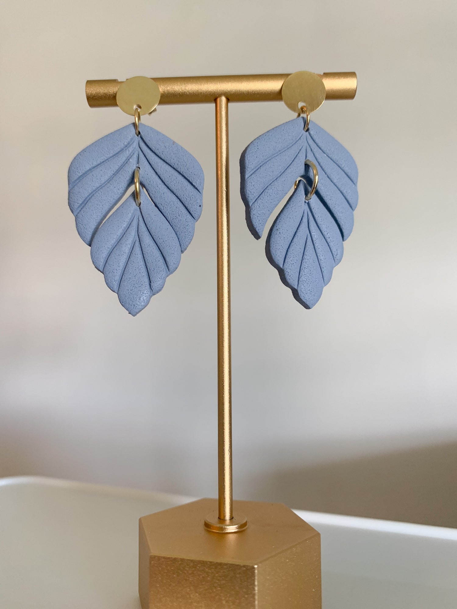 Handcrafted polymer clay earrings with intricate design and 18k gold plated earring posts