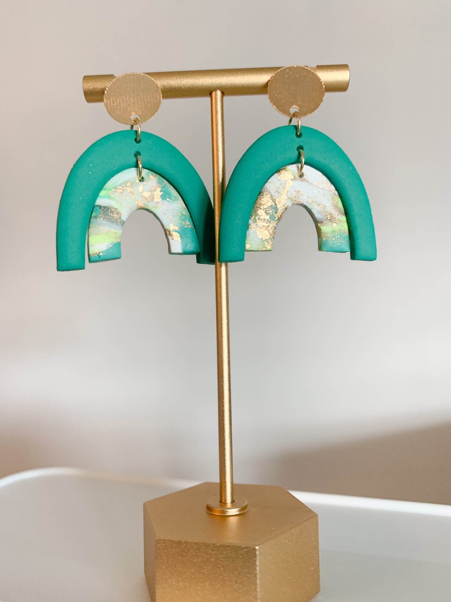 Handcrafted polymer clay earrings with intricate design and 18k gold plated earring posts