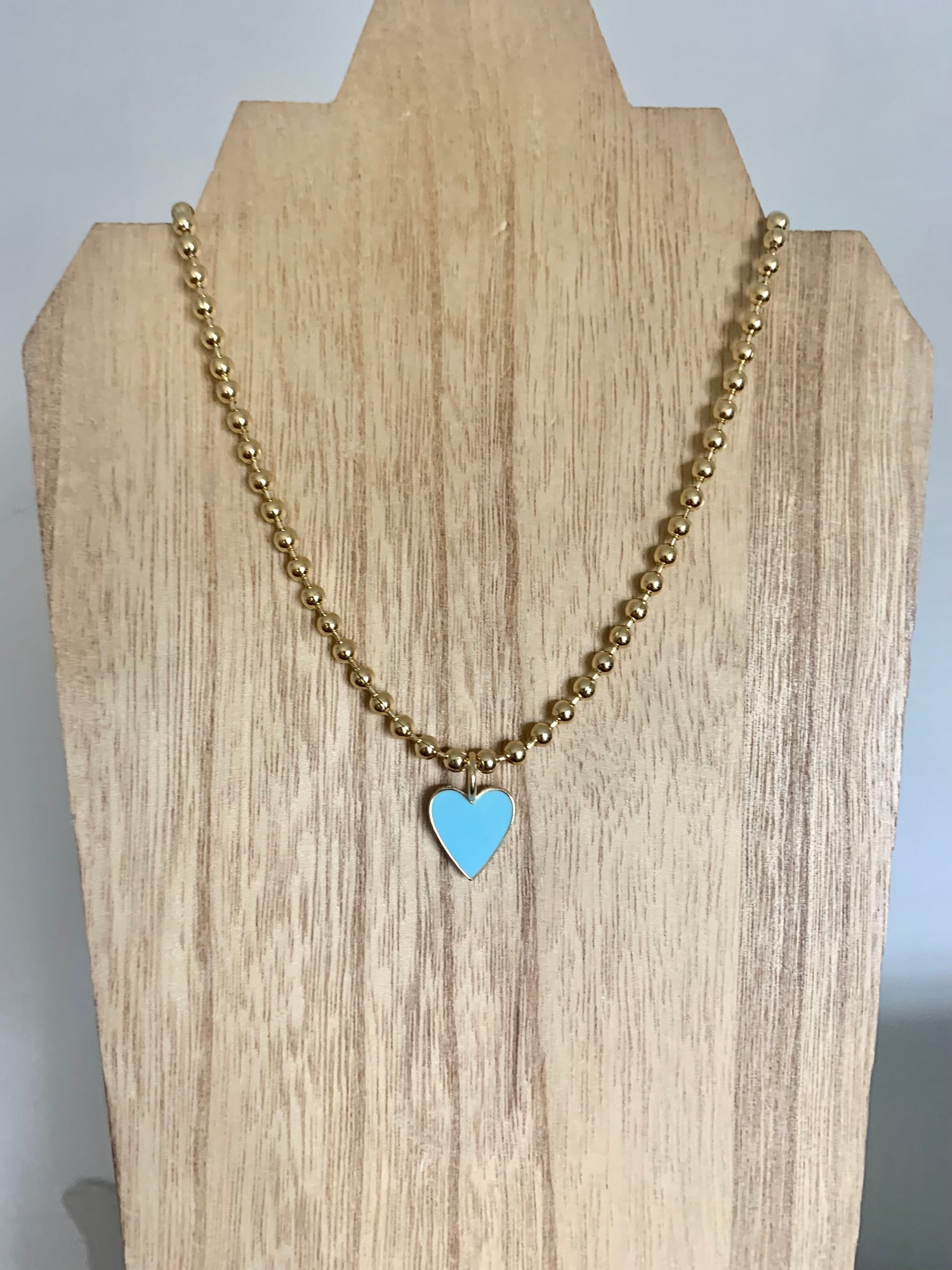 18 Karat Gold Plated Beaded Necklace with Enamel Heart Pendant on a 18 inch adjustable chain.