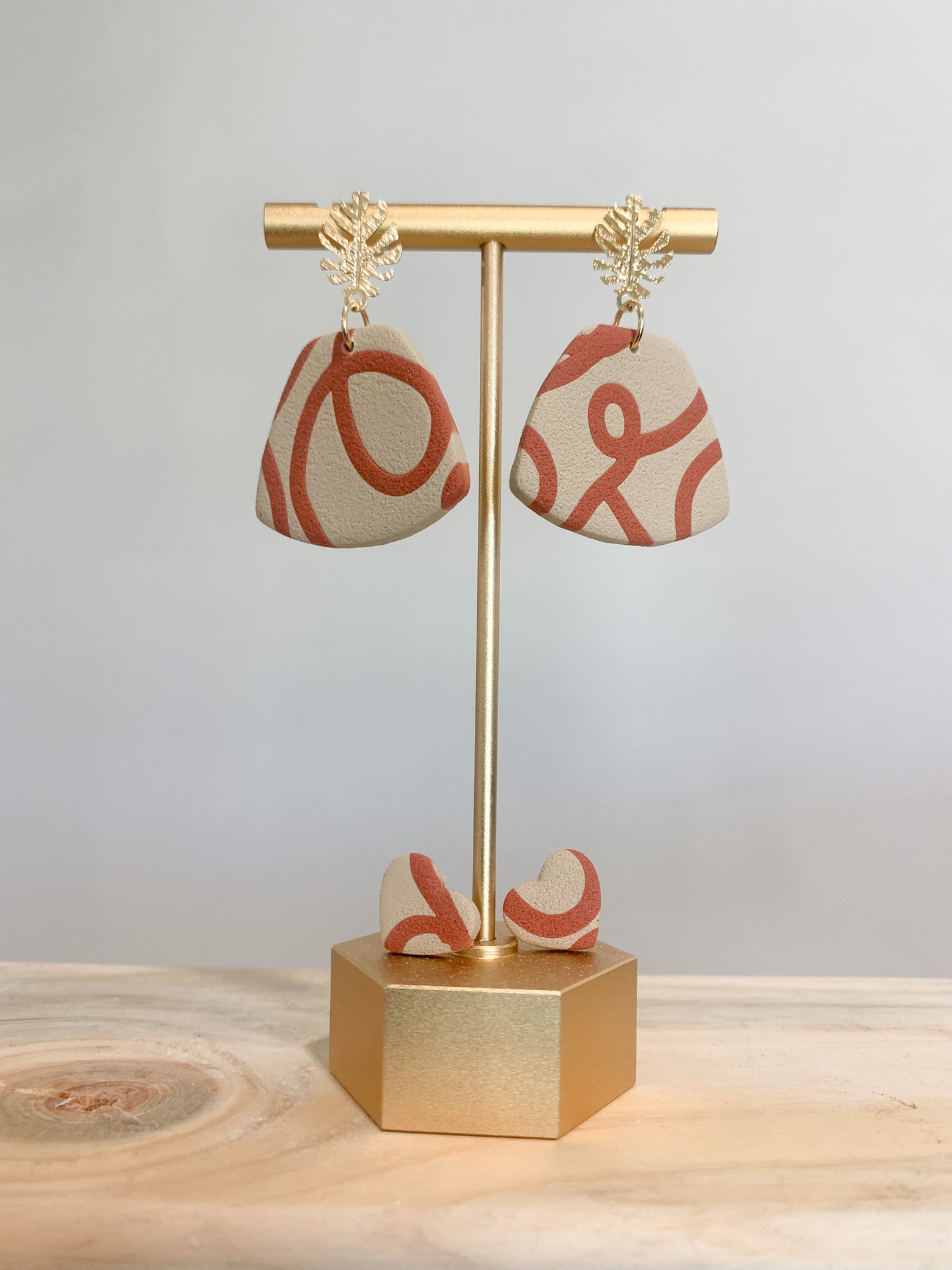 Handcrafted polymer clay earrings with intricate design and 18k gold plated earring posts