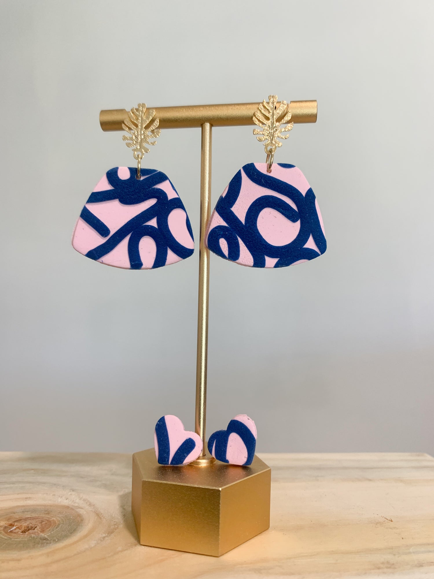 Handcrafted polymer clay earrings with intricate design and 18k gold plated earring posts