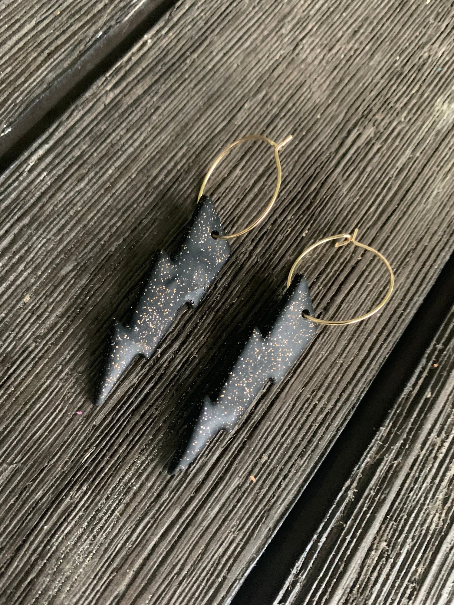 Handcrafted polymer clay earrings with intricate design and 18k gold plated earring posts